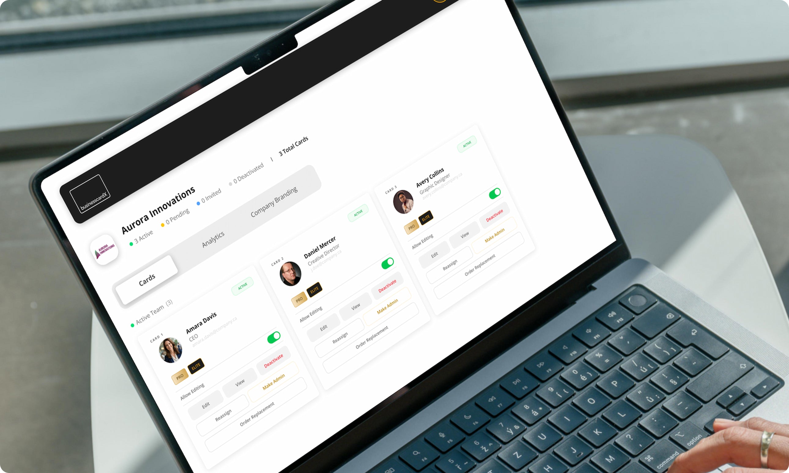 The businesscardX ELITE admin portal showing team management with multiple employee cards